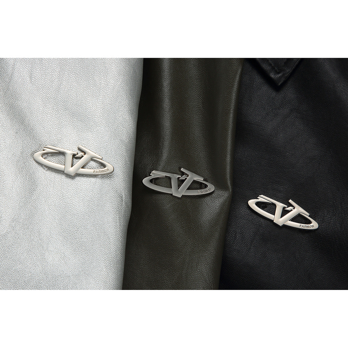 Close-up of matching metal emblems on silver, olive, and black jacket material.