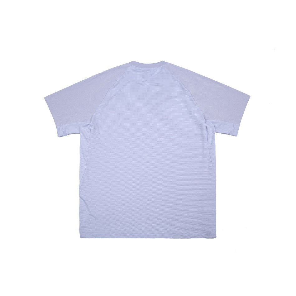 Back flat lay of a lavender T-shirt with a large textured back panel, raglan sleeves, and matching side panels.
