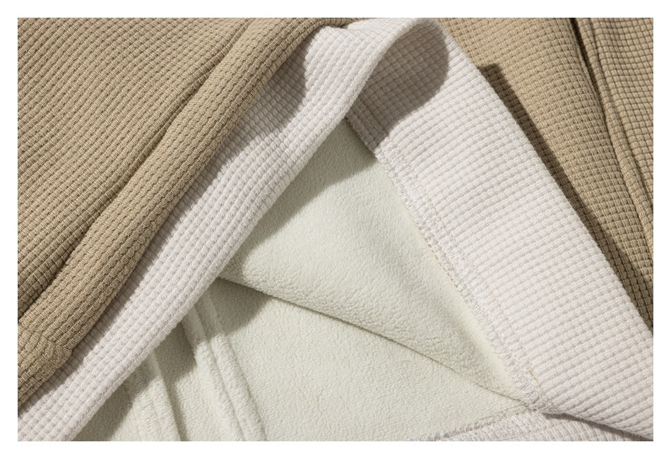 Close-up showing the beige jacket's white collar and soft-looking inner lining.
