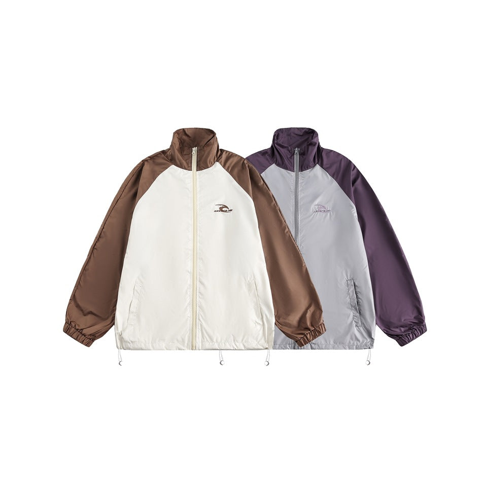 Two zip jackets displayed side by side: one white with brown sleeves, the other gray with purple sleeves.