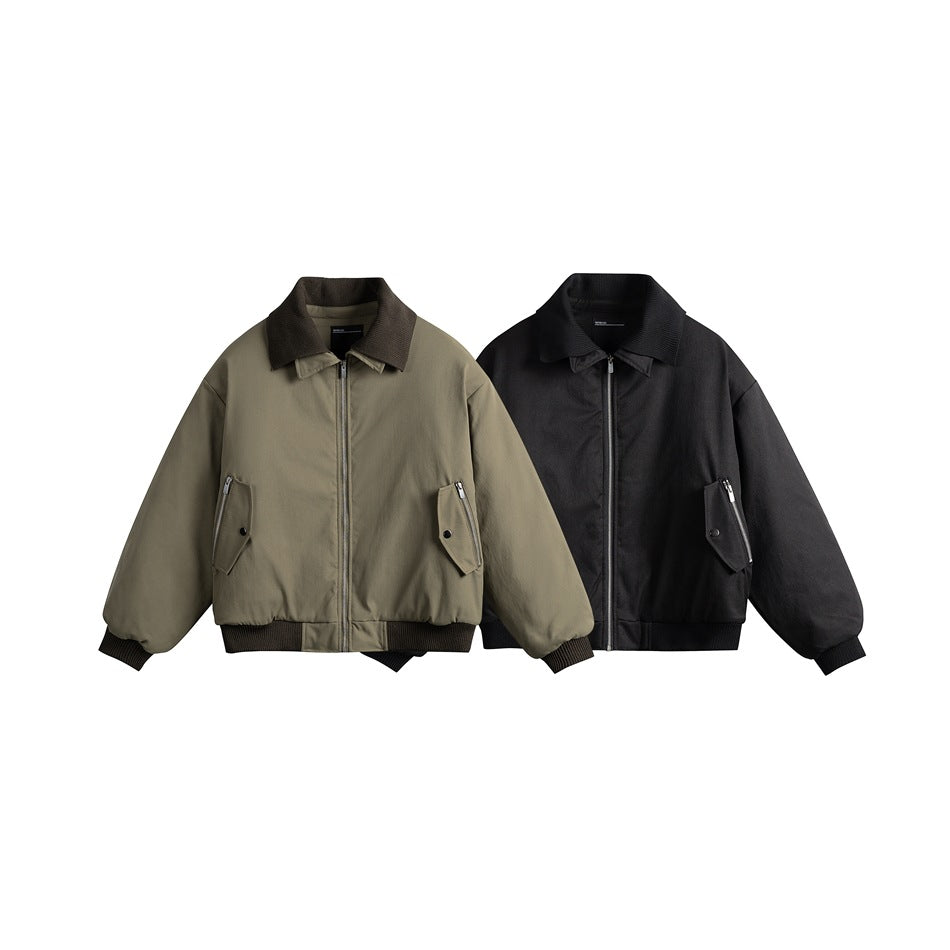 Front view of olive and black zip-front jackets with dark collars, flap pockets, and ribbed cuffs and hems.