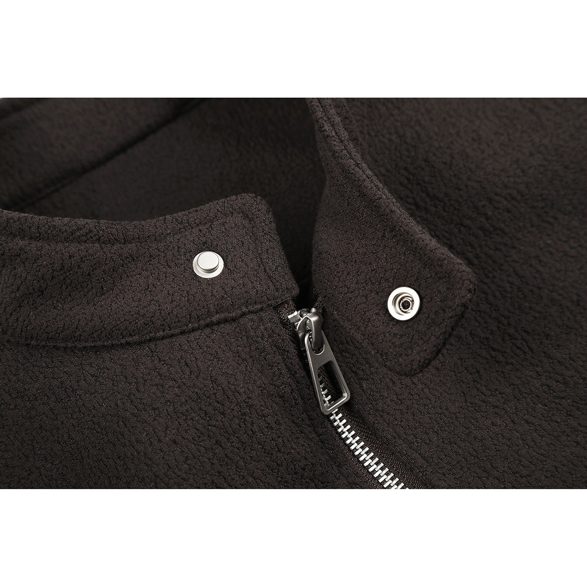 Close-up of a dark brown jacket collar with a silver snap and front zipper.