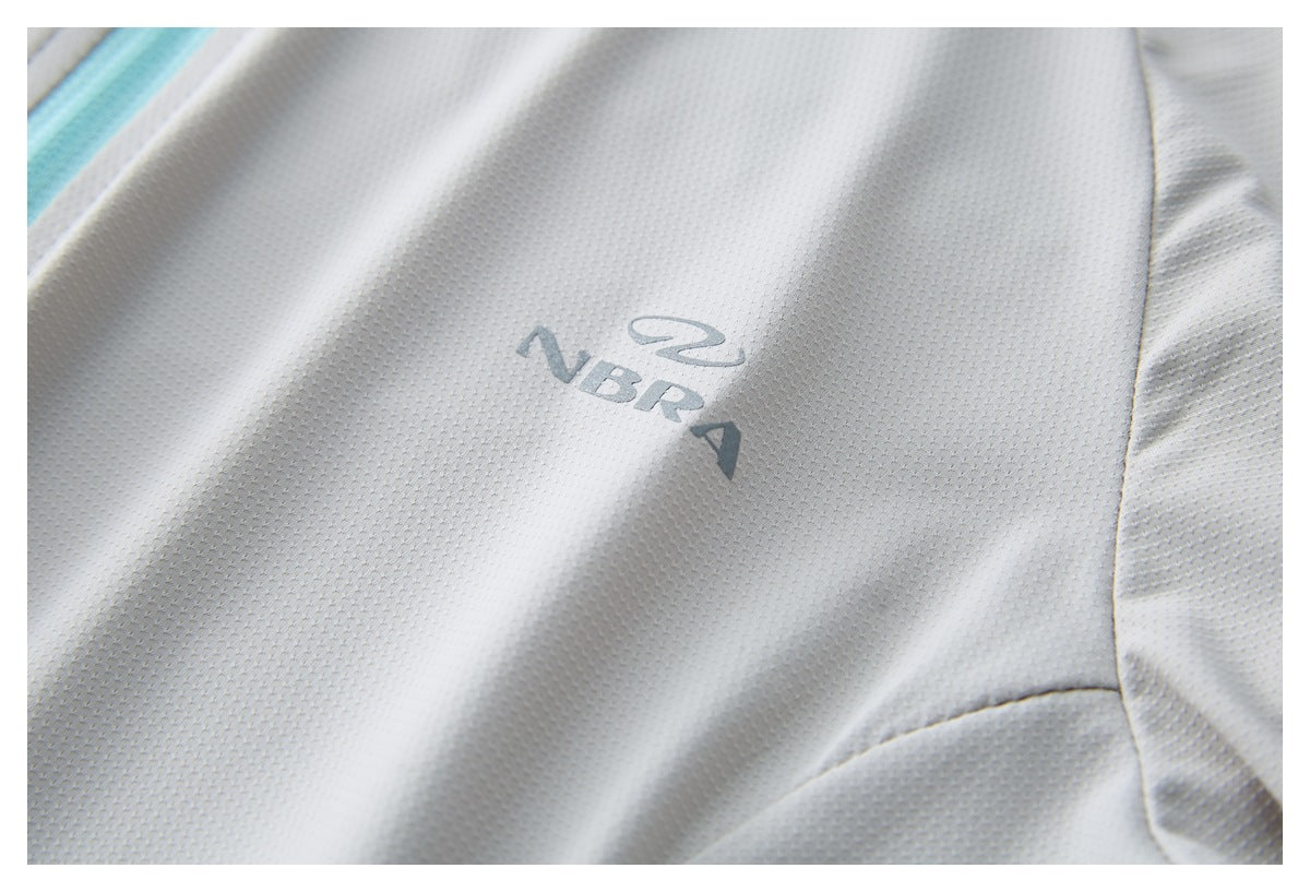 Close-up of a light gray perforated garment with a small gray ZBRA logo.