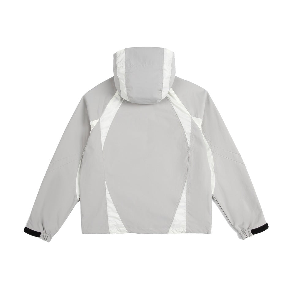 Rear view of a light gray hooded jacket with white contrast panels and black cuff tabs.