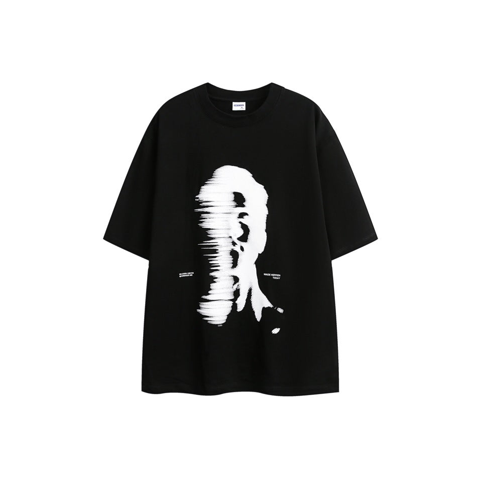 Black short-sleeve crew-neck T-shirt with a large blurred white portrait graphic on the front, flat lay