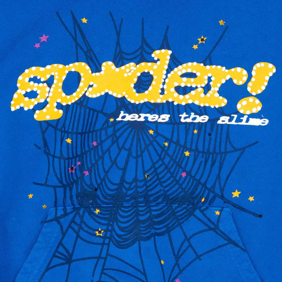 The Sp5der “Hares the Slime” Hoodie (440GSM) features royal blue heavyweight cotton fleece with a black spider web, yellow stars, and a fuzzy yellow "spider!" logo above the phrase "hares the slime" in white for premium streetwear style.