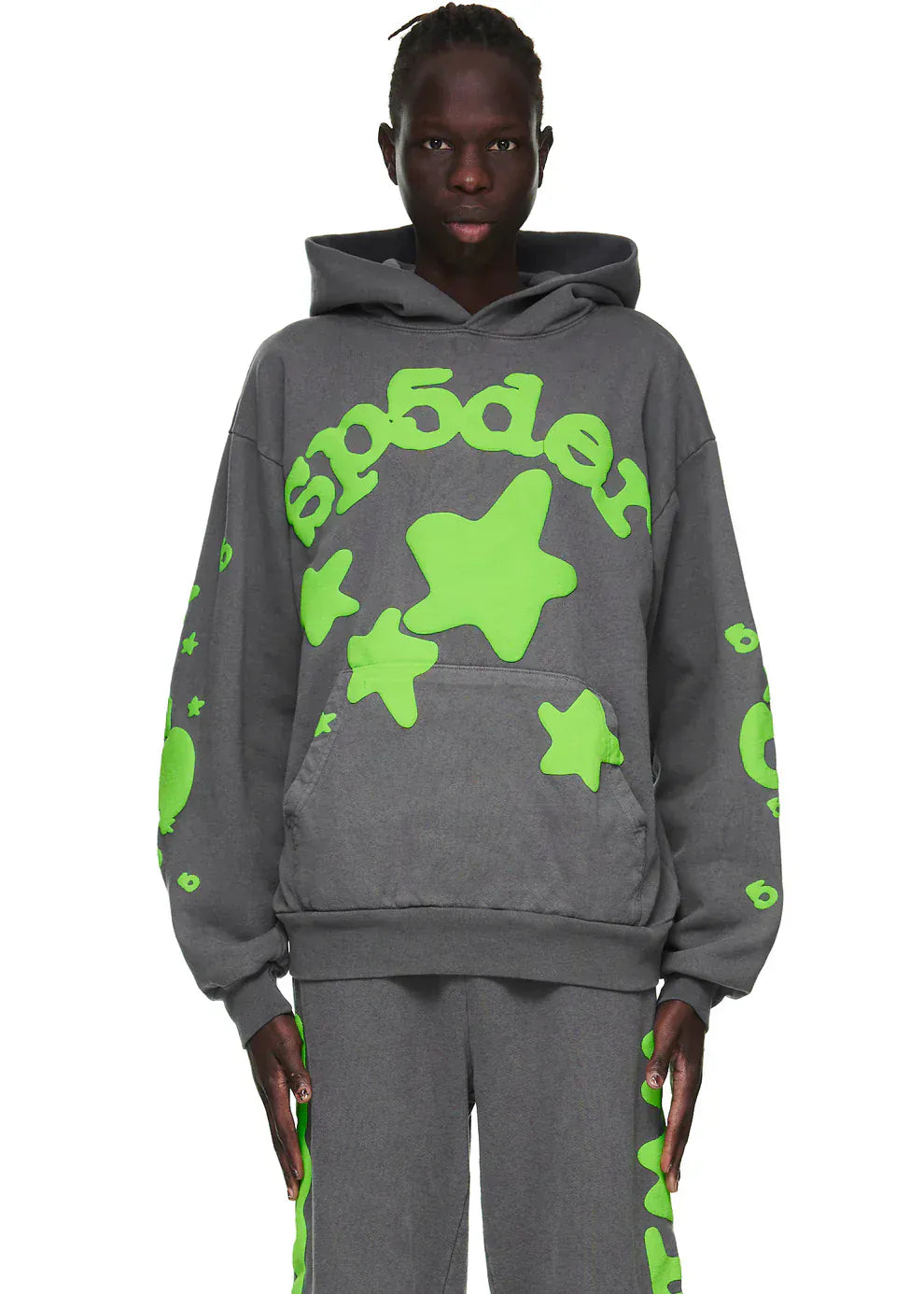 Wearing the Sp5der 440GSM Heavyweight Hoodie – Grey & Neon Green Star Graphic Oversized Sweatshirt, this look features bold neon green star and text designs on thick fleece—ideal for standout streetwear style against a plain background.