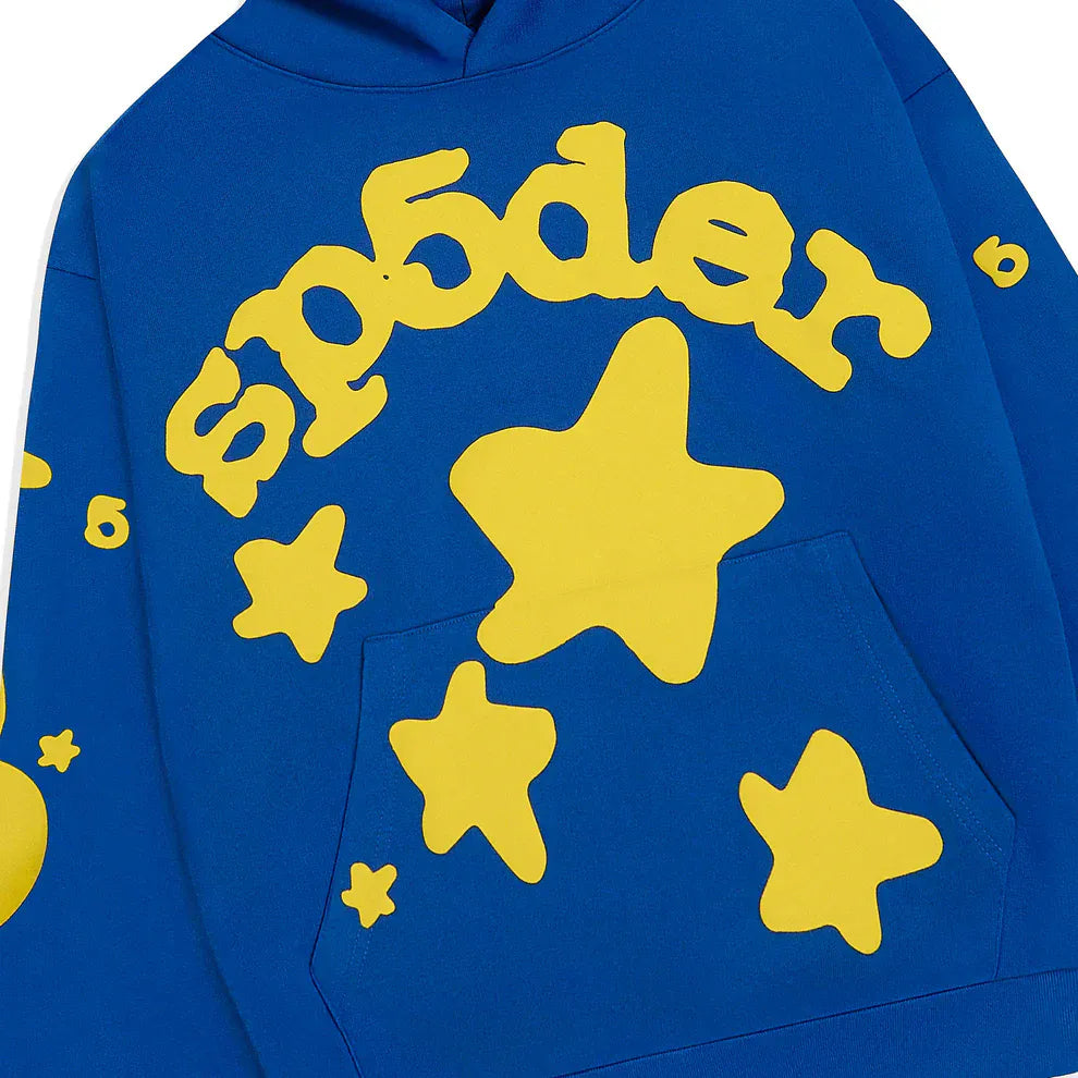 The Sp5der 440GSM Heavyweight Hoodie in royal blue features yellow star 3D puff print and bold Sp5der lettering, making it perfect for a standout Y2K-inspired streetwear look.