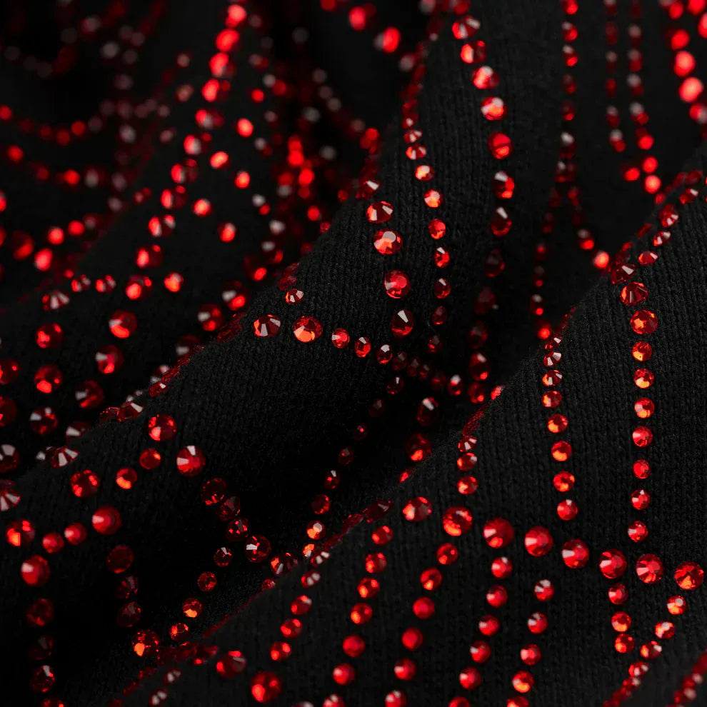 Close-up of heavyweight 440GSM cotton fleece with shiny red rhinestones in wavy rows—signature accents of the Sp5der Rhinestone Web Hoodie – Black, an oversized luxury streetwear pullover.