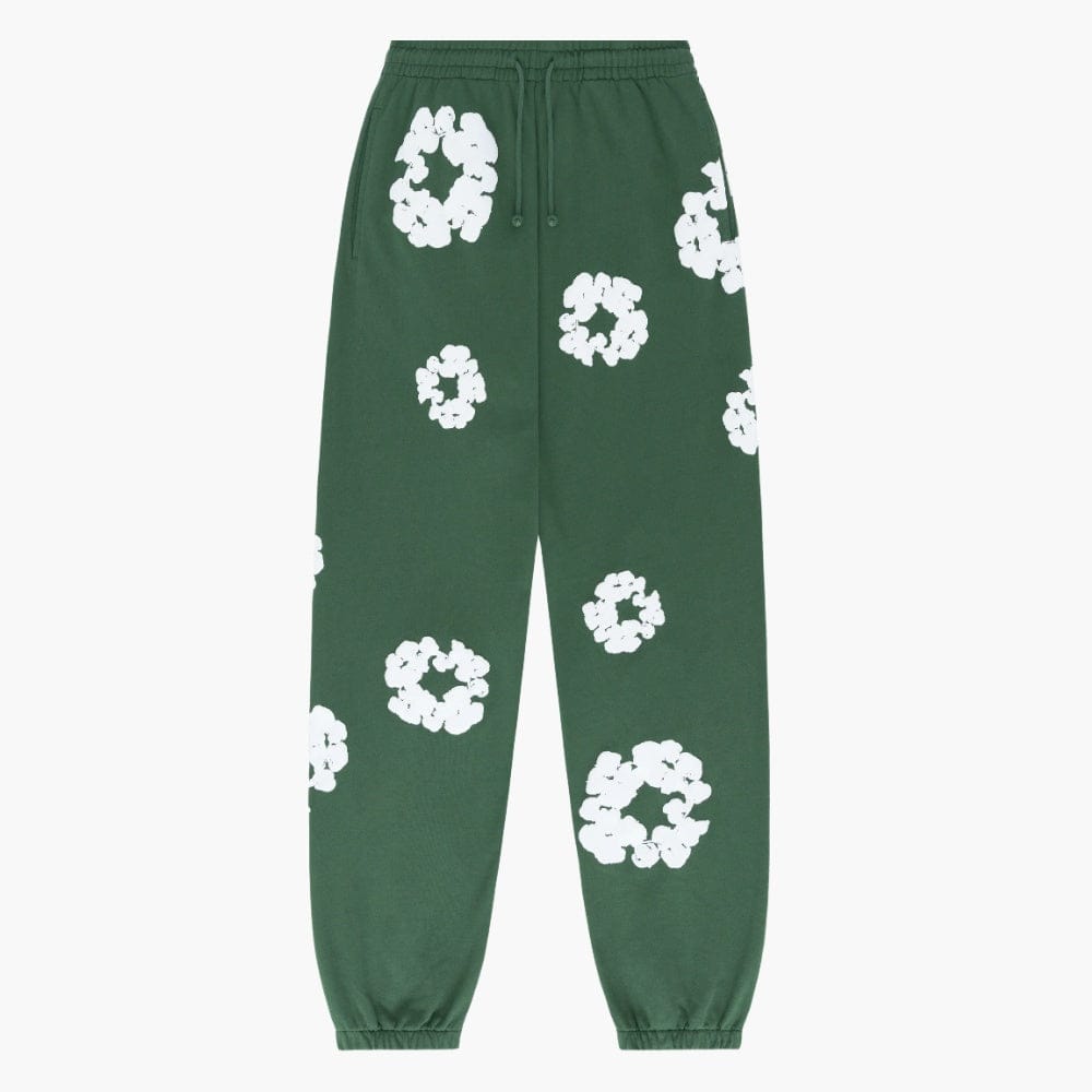 Forest Green “Cotton Wreath” Denim Tears Sweatpants with an elastic waistband and cuffs, featuring a white floral print scattered across the fabric.