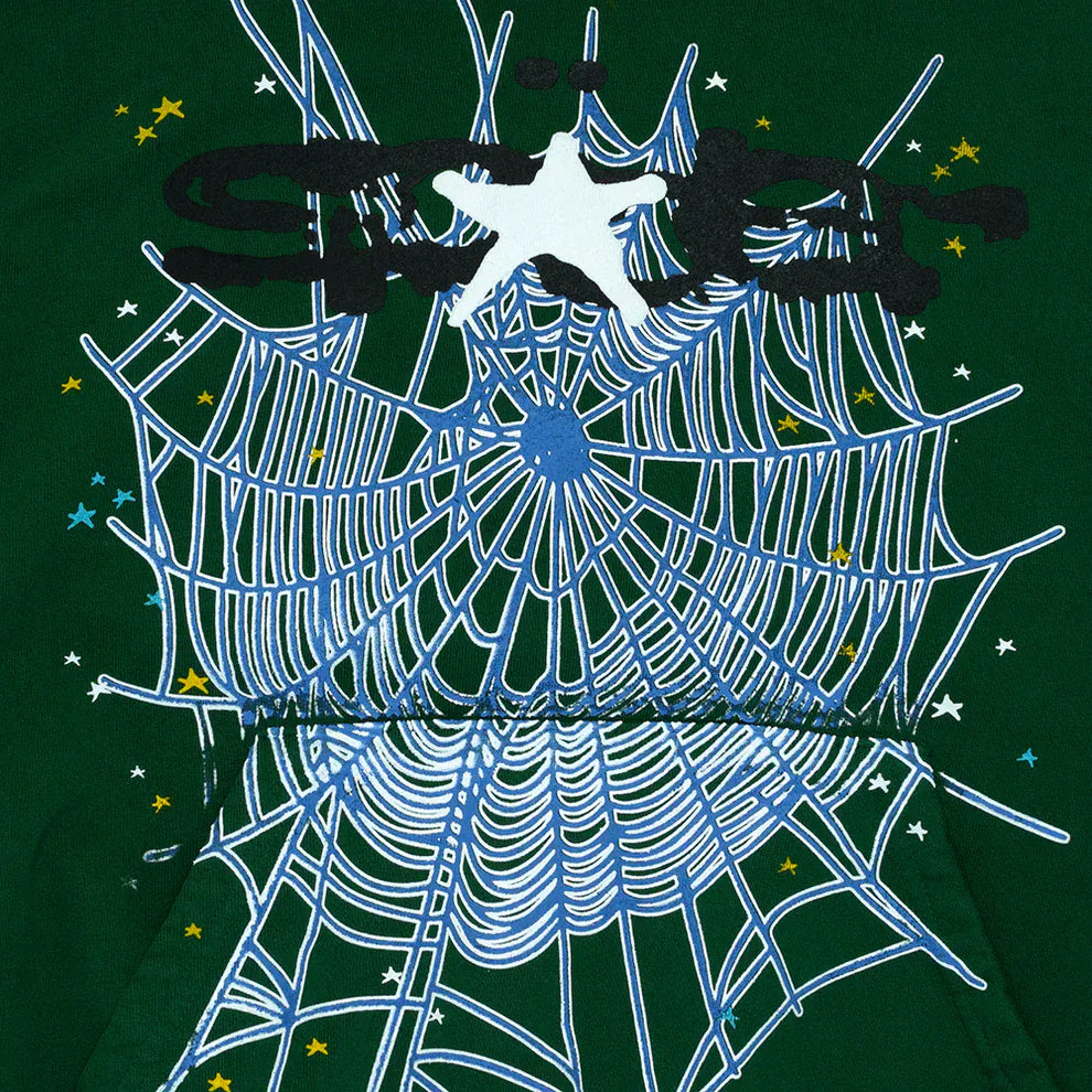 The Dark Green Graphic Hoodie with Spider Web Print features a white silhouette mid-air over a bold web and stars, offering comfort fit for everyday wear—perfect for streetwear style.