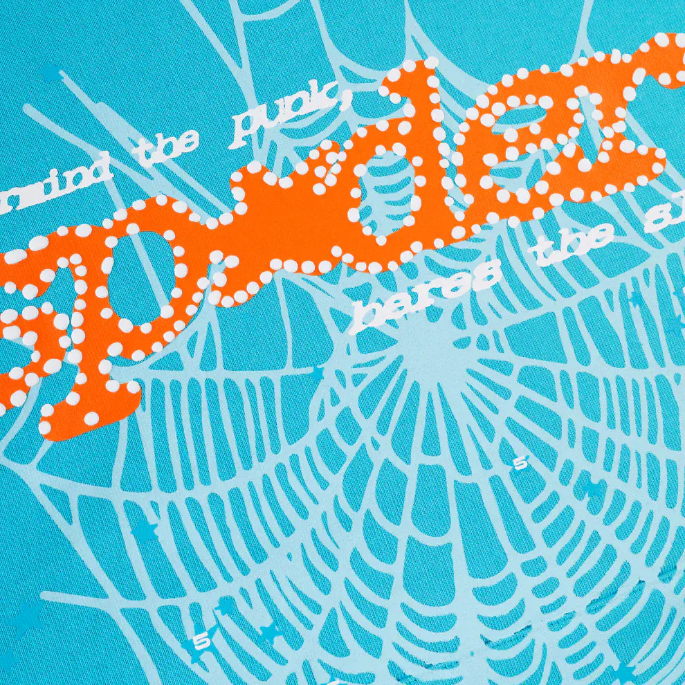 The Sp5der “Nevermind the Spider” Hoodie in sky blue features an orange dotted "spider" on a stylized light blue web, bold streetwear style, white background text, and is crafted from premium 440GSM heavyweight cotton fleece.
