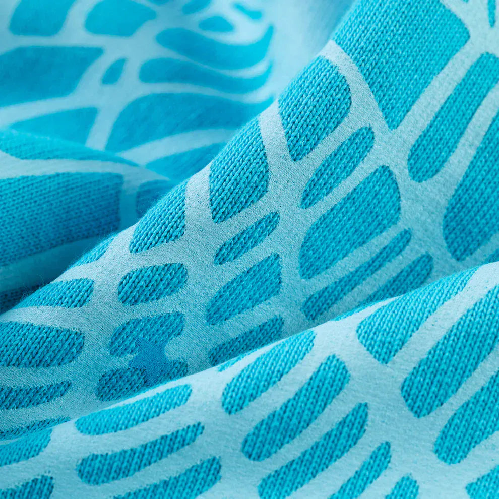 Close-up of the Sp5der “Nevermind the Spider” Hoodie – Sky Blue, crafted from 440GSM heavyweight premium cotton fleece with an abstract wavy pattern in blue, ideal for stylish streetwear looks.
