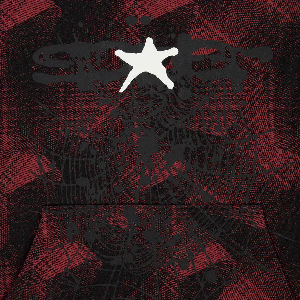 The Red and Black Graphic Hoodie with Star Detail and Spider Web Print is a comfort fit pullover featuring a bold plaid pattern, black spiderweb and spider design, plus a standout white star—ideal for streetwear style.