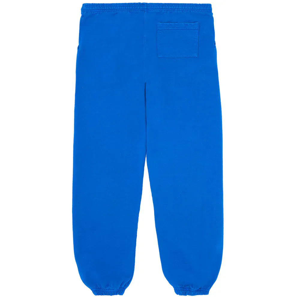 The Sp5der Sweatpants are unisex blue cotton joggers with a yellow side logo and star print, featuring elastic cuffs, waistband, and a right patch pocket—ideal for any streetwear collection.