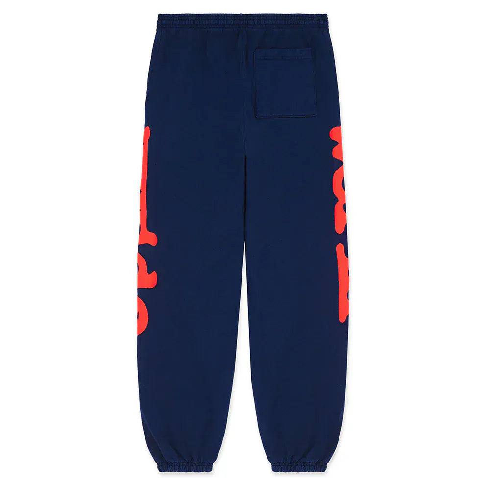 Sp5der Sweatpants Navy Blue Red Side Logo Print: 100% cotton jogger pants with elastic cuffs, back pocket, and bold red graphics on both legs—streetwear style that stands out.