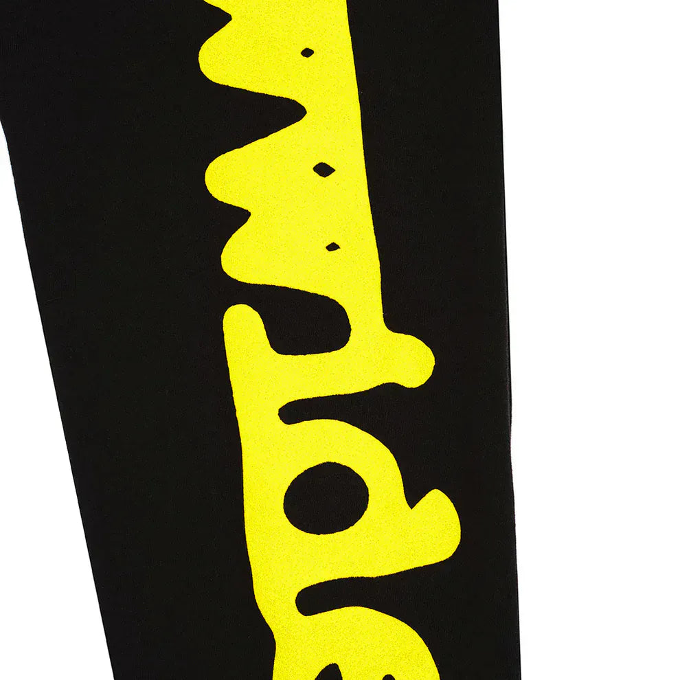 The Sp5der Sweatpants Black Yellow Side Logo Print, made from 100% cotton, stand out with bold wavy yellow text down the side—a perfect streetwear choice for jogger pants enthusiasts.