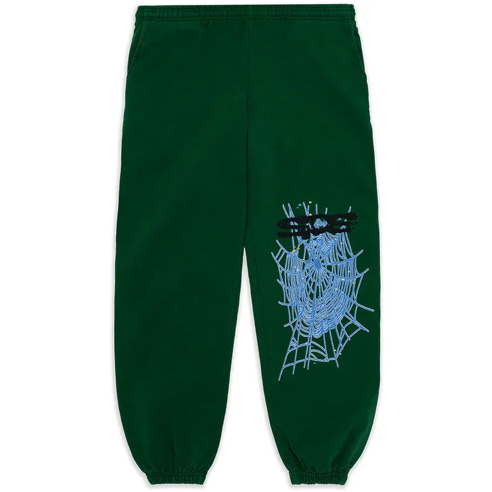 100% Cotton Sp5der Sweatpants for Men in dark green, relaxed fit with elastic cuffs, featuring a bold blue spiderweb graphic and black spider on one leg—distinctive streetwear jogger style.