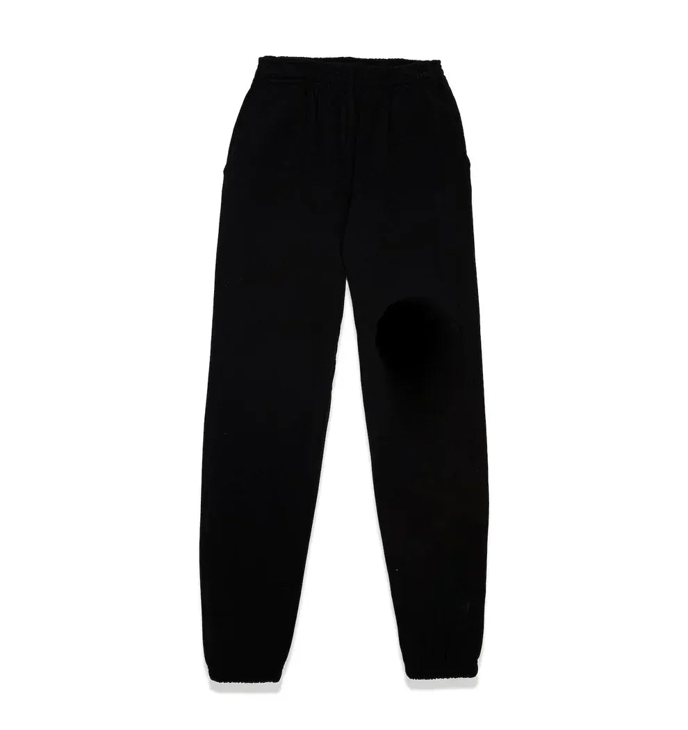 A pair of 100% cotton Sp5der sweatpants for men in black, featuring a yellow logo graphic, relaxed fit, elastic waistband and cuffs, laid flat on a white background.