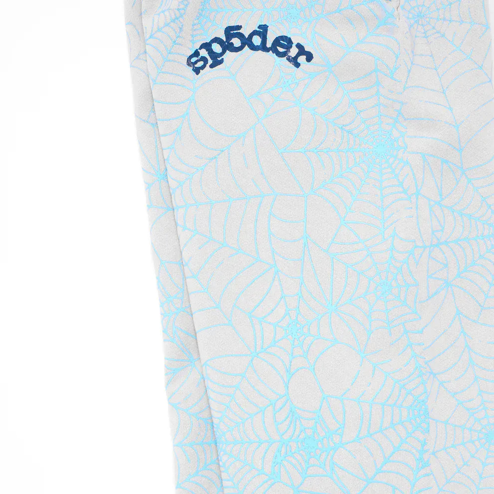 Close-up of 100% Cotton Sp5der Sweatpants for Men – light grey jogger pants with blue all-over spider web print and "sp5der" embroidery, showcasing their unique style and relaxed fit.