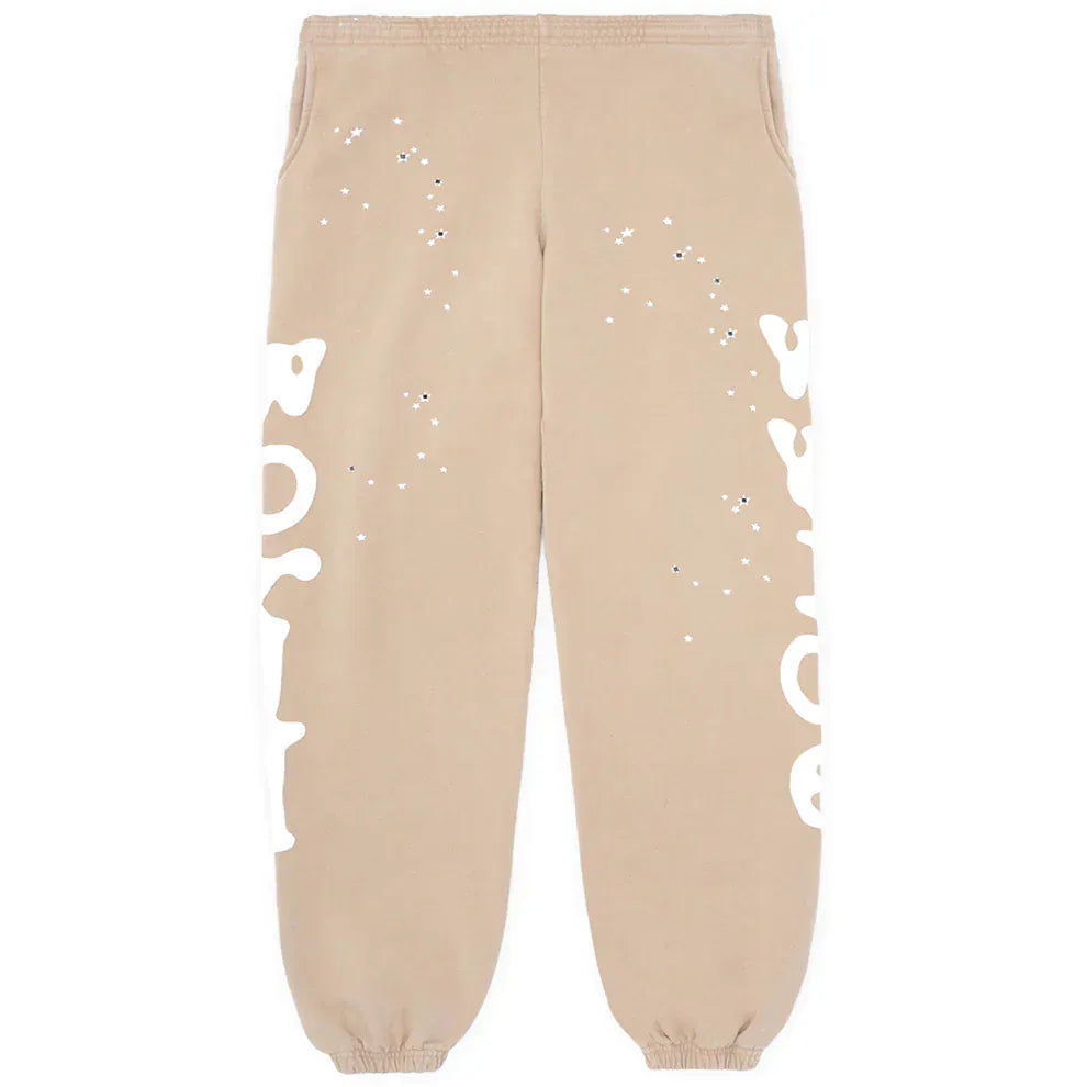 100% Cotton Sp5der Sweatpants for Men: Beige streetwear jogger pants with a relaxed fit, elastic cuffs and waistband, and side logo graphic.
