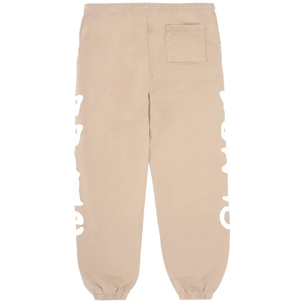 100% Cotton Sp5der Sweatpants for Men: beige streetwear jogger pants with a relaxed fit, elastic waistband and cuffs, single back pocket, and side logo graphic.