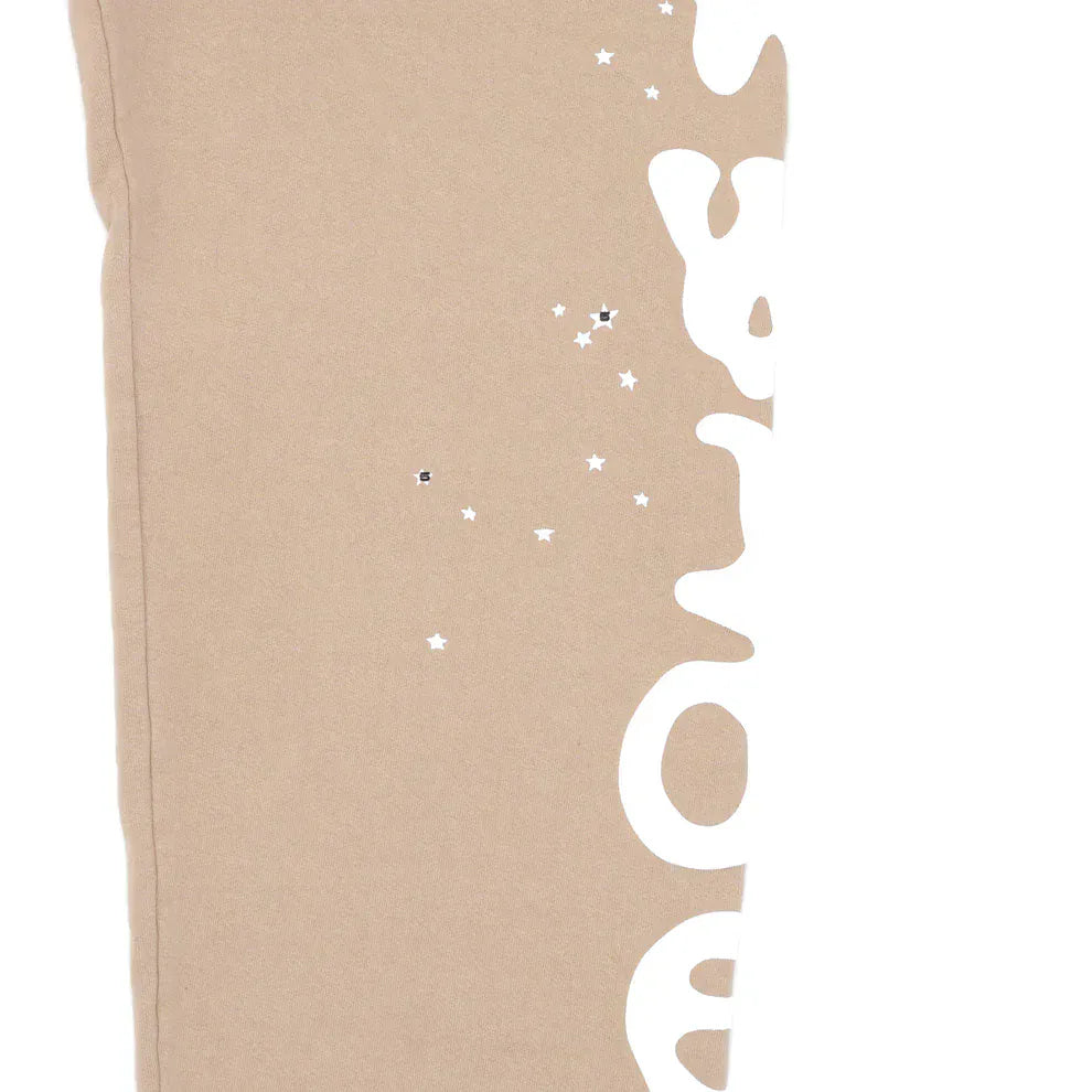 100% Cotton Sp5der Sweatpants for Men – Beige streetwear jogger pants with a side logo graphic and relaxed fit, perfect as a standout piece in any beige casual wardrobe.