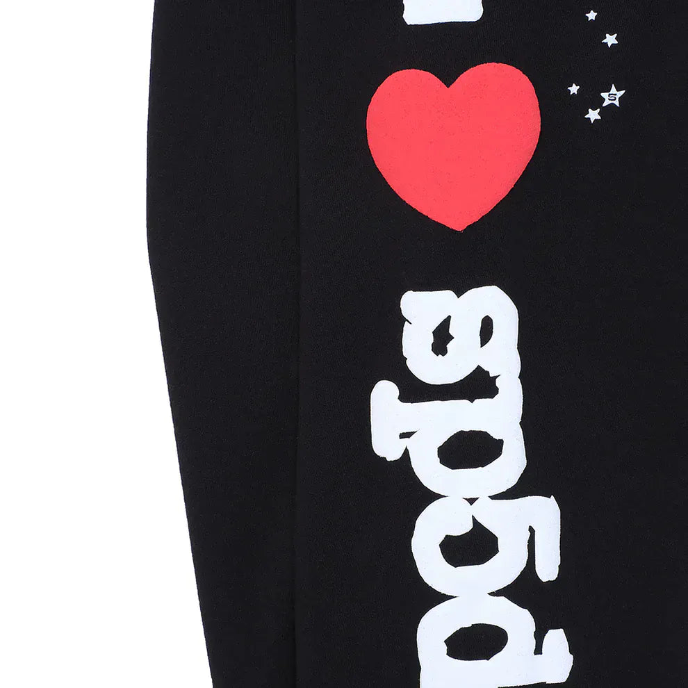 Unisex black Sp5der sweatpants in 100% cotton, featuring “I Love Sp5der” print with a red heart above white vertical text and star accents for a bold and stylish streetwear look. Relaxed fit jogger pants.