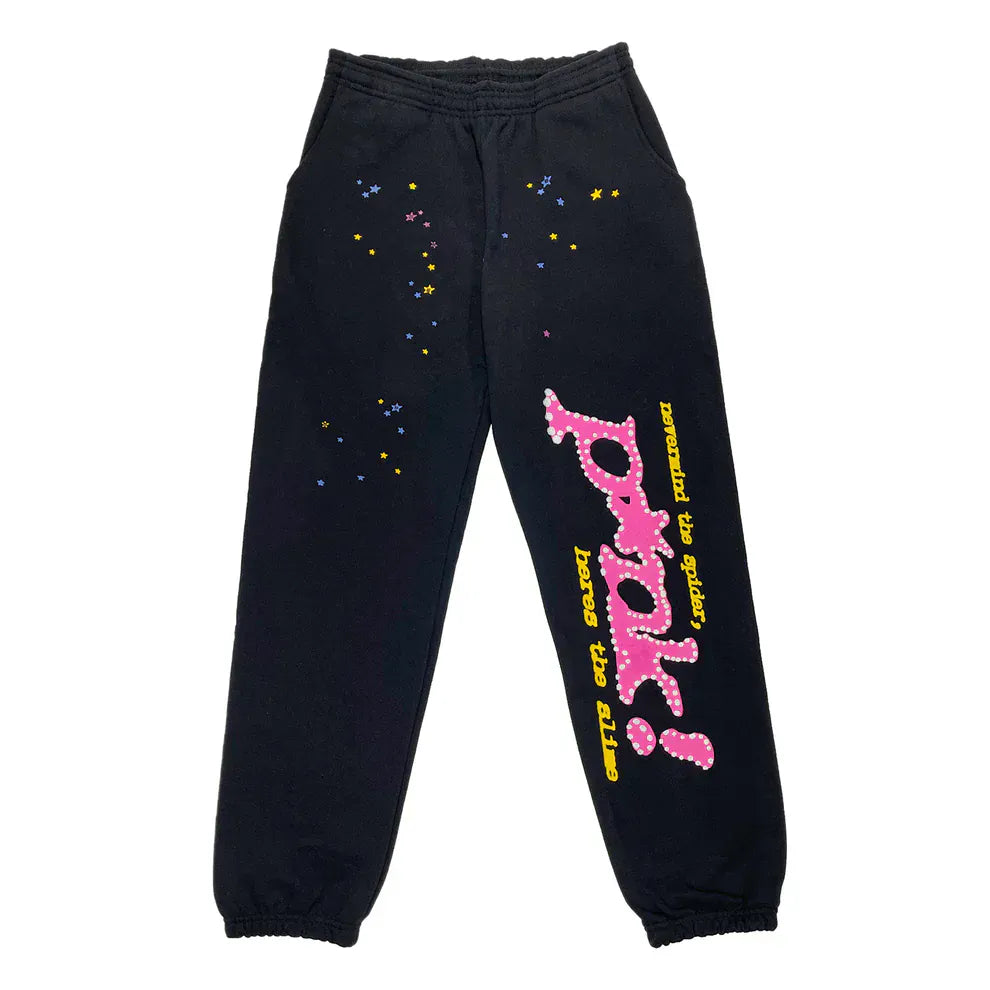Unisex 100% cotton Sp5der black sweatpants with relaxed fit, bold pink logo graphics, and colorful star accents—ideal for streetwear lovers seeking standout style.