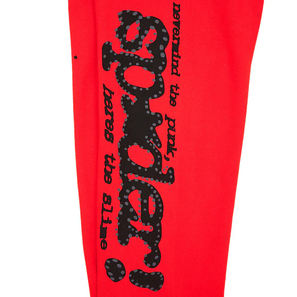 Made from 100% cotton, these unisex Sp5der Sweatpants feature bold black logos and star graphics on red fabric. With a relaxed fit, they're perfect statement joggers for standout streetwear style.