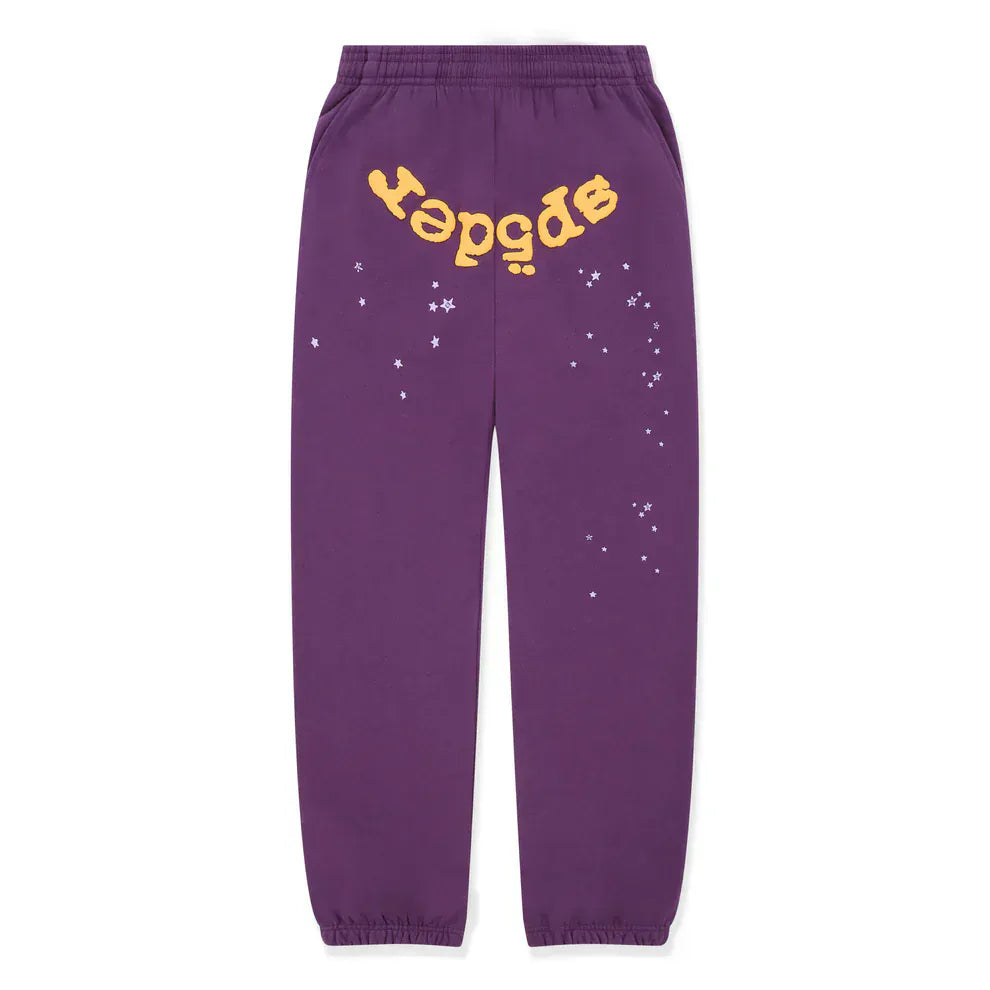 The 100% Cotton Sp5der Sweatpants are unisex purple jogger pants with a yellow logo and star graphics. With an elastic waistband and cuffs, these relaxed fit sweatpants combine comfort and standout streetwear style.
