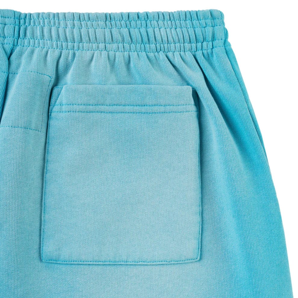 Close-up of the back pocket and elastic waistband of the 100% Cotton Sp5der Sweatpants – Unisex Blue Jogger Pants with spider web graphic, star details, relaxed fit, and premium stitching.