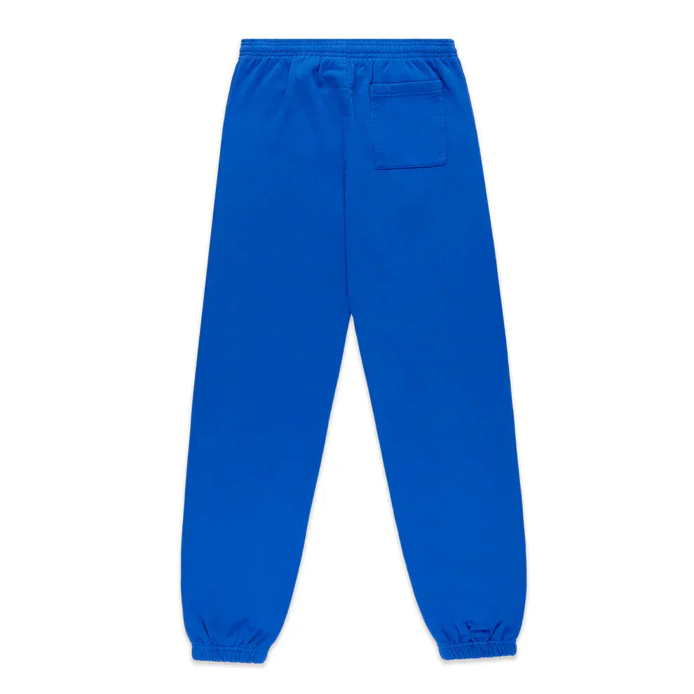 The 100% Cotton Sp5der Sweatpants are unisex blue jogger pants featuring a pink logo, star accents, elastic waistband and cuffs, single rear patch pocket, and a relaxed fit—perfect for streetwear style.