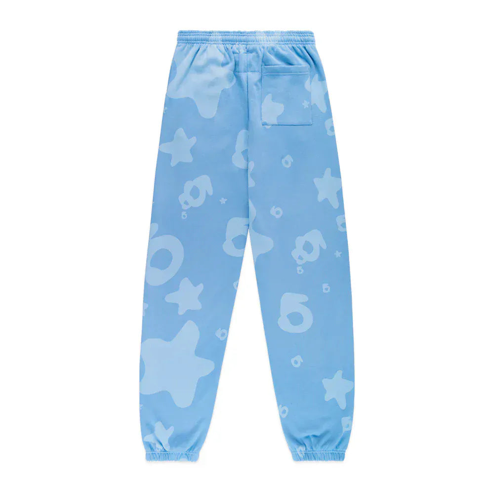 The Sp5der Light Blue All-Over Print Sweatpants are unisex 100% cotton joggers featuring abstract star patterns, an elastic waistband and cuffs, plus a back pocket—stylish streetwear for any casual look.