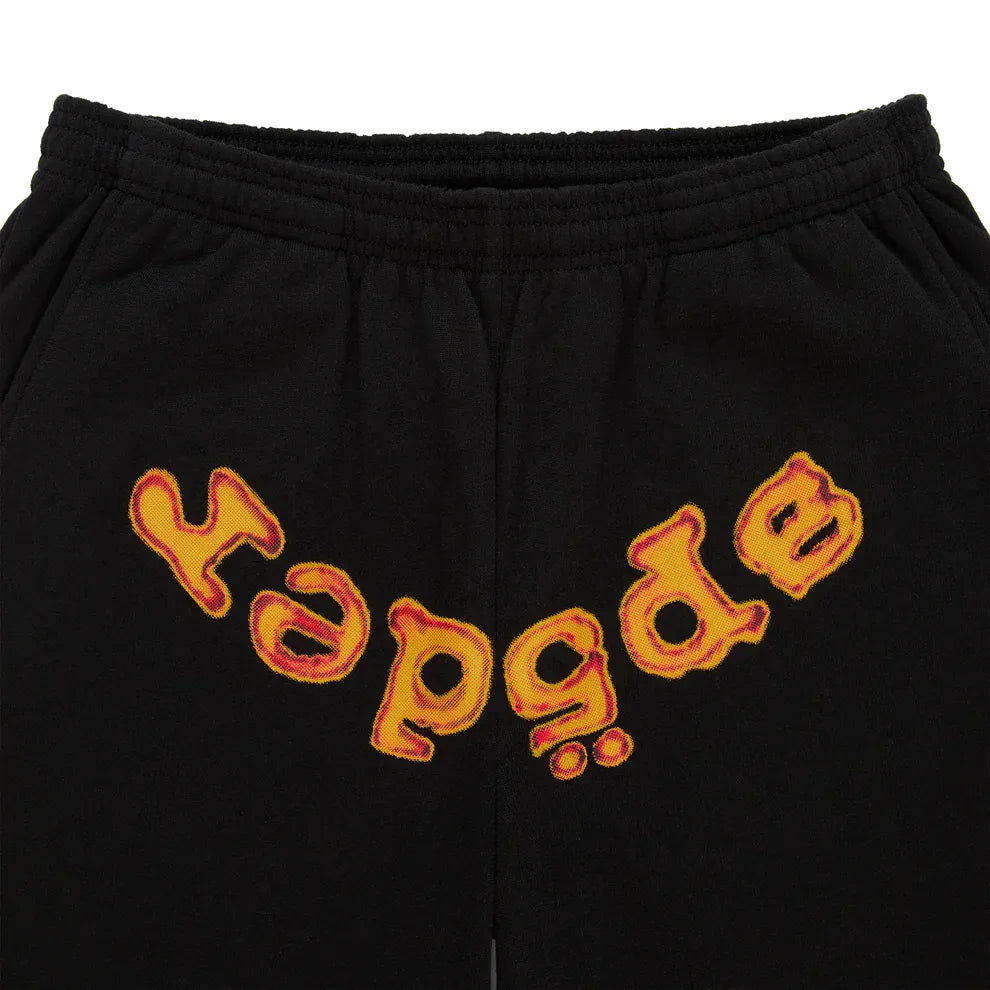 Unisex black cotton Sp5der sweatpants featuring an elastic waistband and a flame front logo print, inspired by streetwear style.