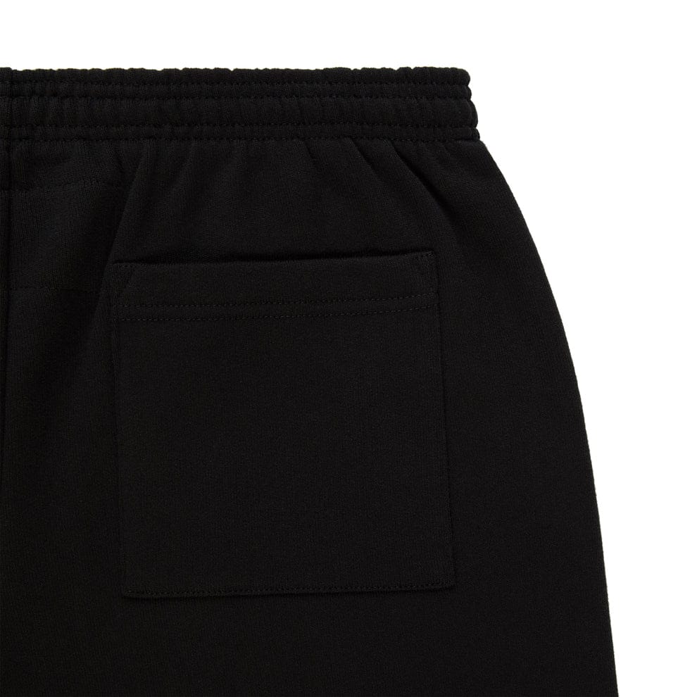 Close-up of the Sp5der Sweatpants – Unisex Black Cotton Sweatpants with Flame Front Logo Print, highlighting the elastic waistband, square back pocket, and modern streetwear joggers style.