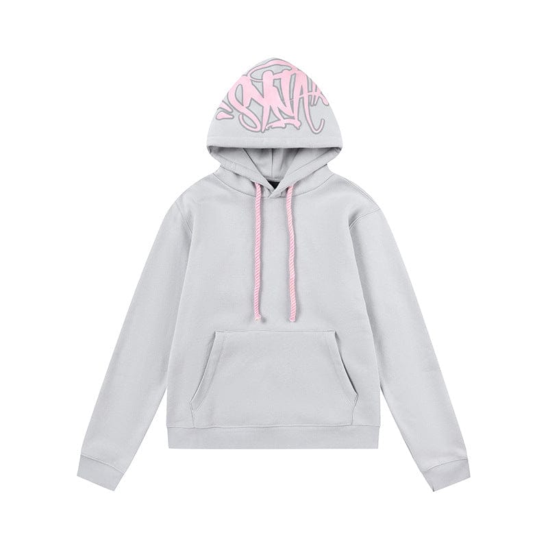 The Syna World Graphic Hoodie is a pullover streetwear hoodie available in 6 colors, featuring light gray fabric, a front pocket, pink drawstrings, and bold pink graffiti-style hood lettering—ideal for streetwear and Syna World fans.