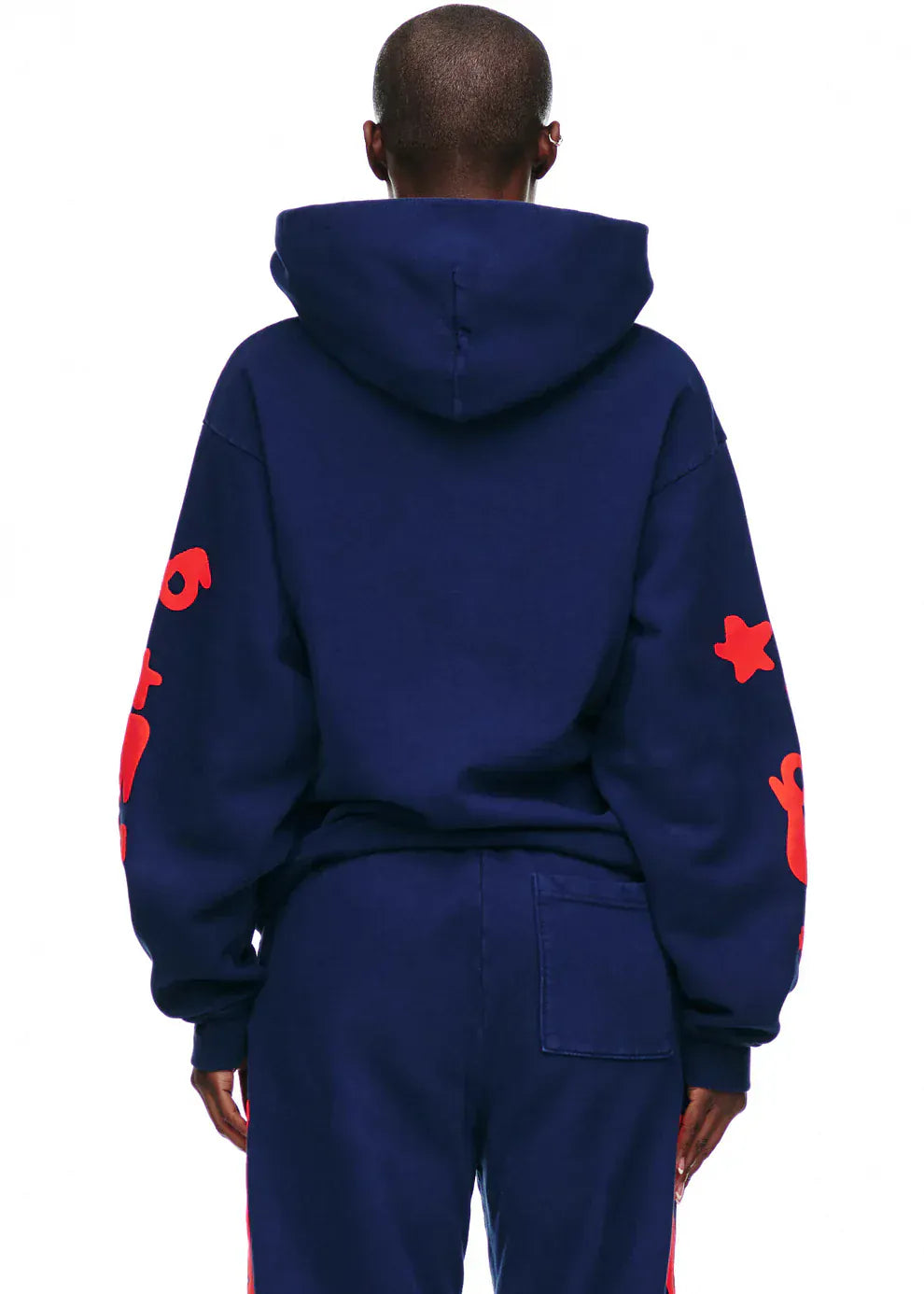 Wearing the Sp5der 440GSM Heavyweight Hoodie in navy blue with red star puff print, paired with matching navy pants—this streetwear pullover is the perfect bold Y2K fashion statement.