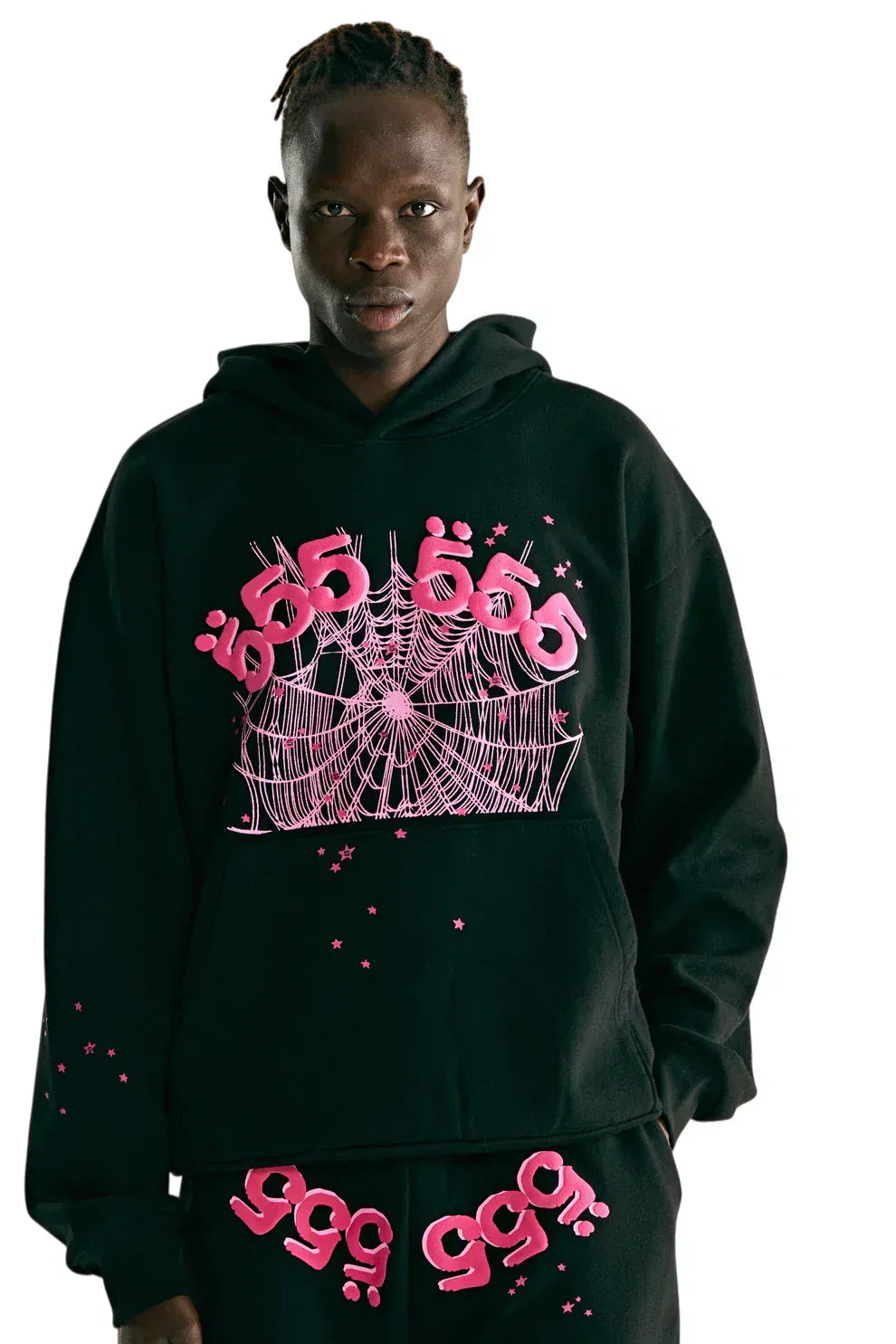 Wearing the Sp5der 555 Hoodie – Black & Pink Web 440GSM Heavyweight Streetwear Pullover, featuring a pink spiderweb and stylized pink text, this look is ideal for fans of Y2K street fashion and luxury streetwear.