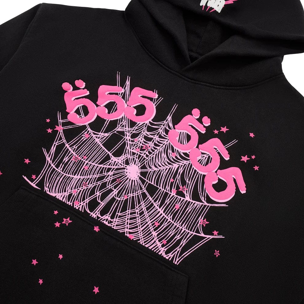 The Sp5der 555 Hoodie – Black & Pink Web 440GSM Heavyweight Streetwear Pullover features a pink spiderweb, stars, and stylized "555" texts with umlauts on the chest, blending luxury streetwear and Y2K fashion.
