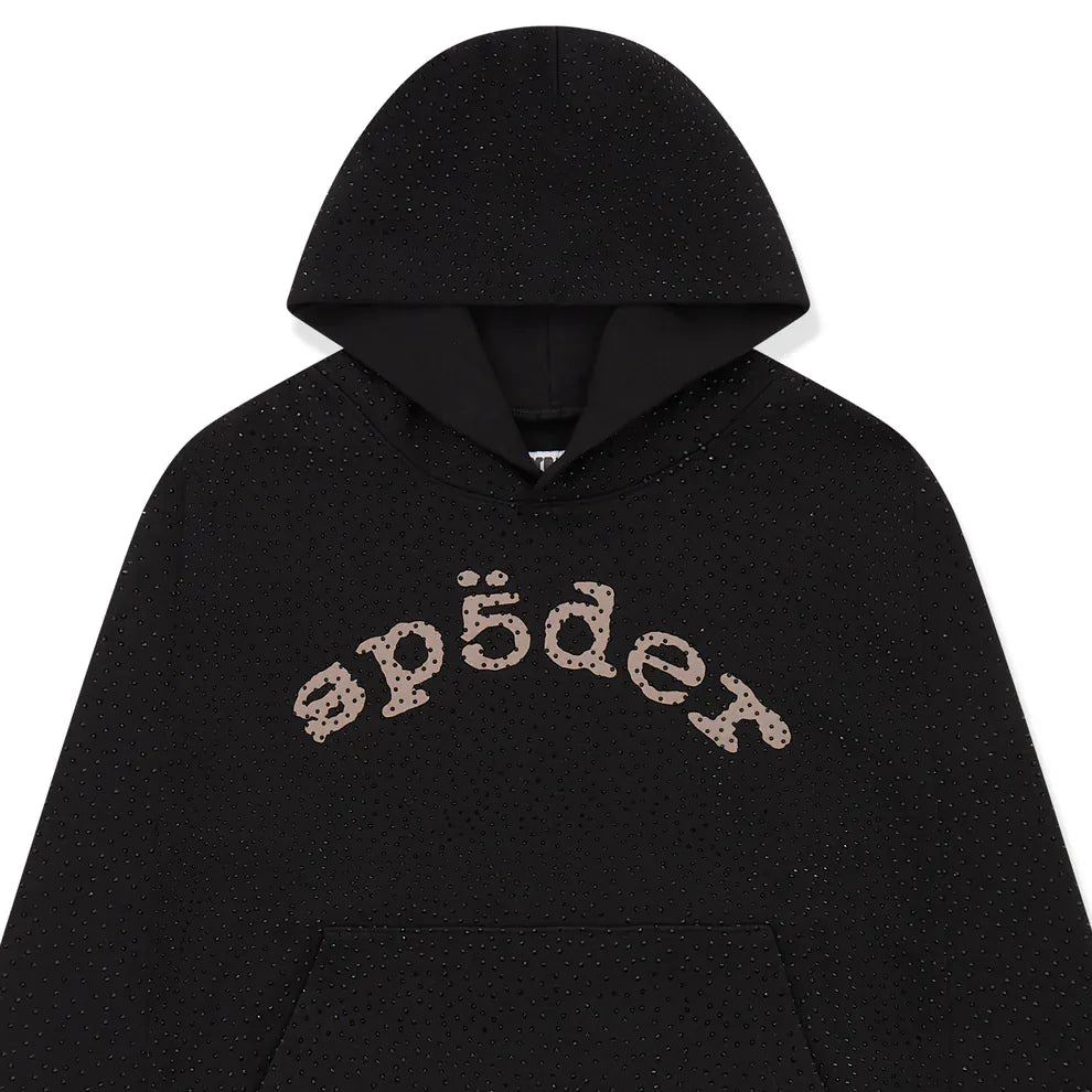 The VVS Spider Hoodie is a black Sp5der rhinestone pullover with diamond graphic detail and tan stylized sp5der text across the chest.