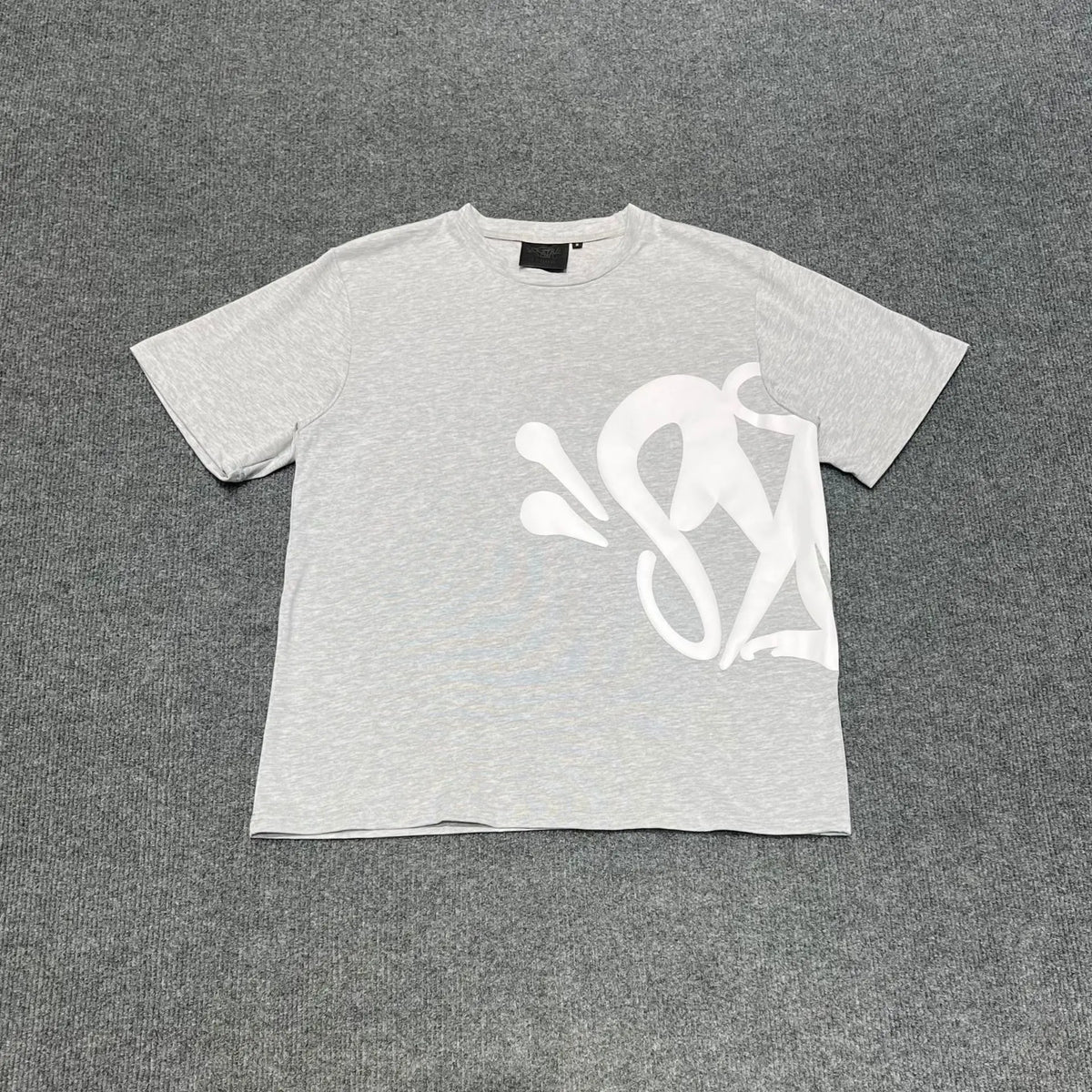 Light grey oversized crew neck T-shirt with large white script letter front graphic print